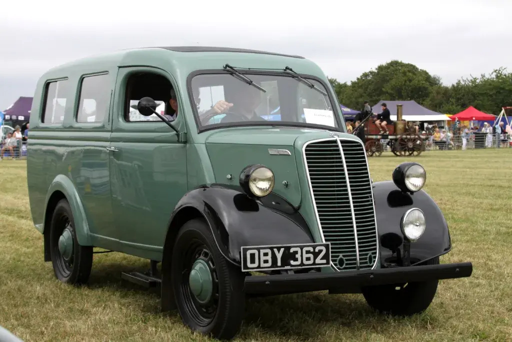 A row of classic cars parked together at the vintage vehicle display